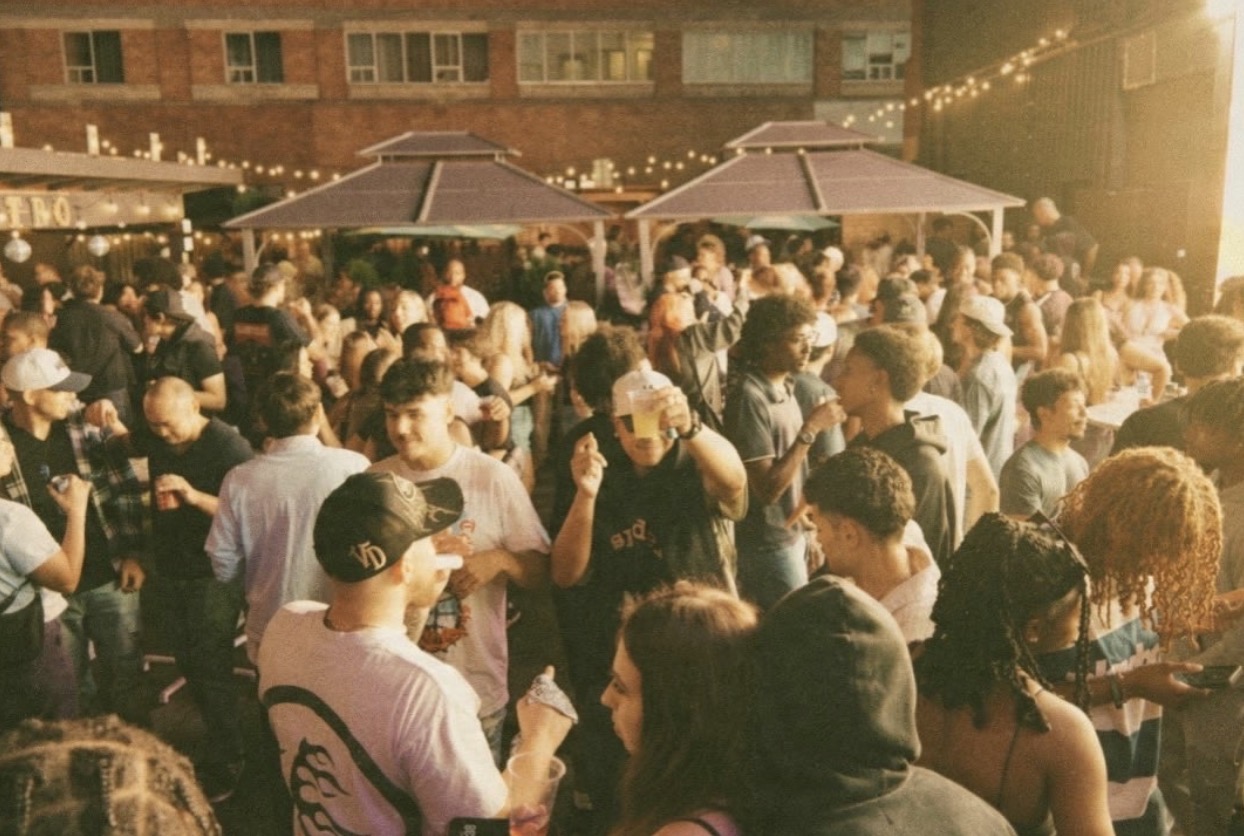A packed crowd enjoying an outdoor DJ Facey event